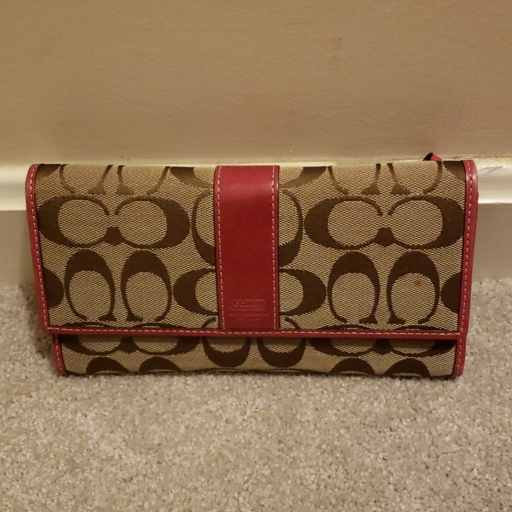 Coach wallet with coach pattern and pink trim